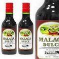 малага